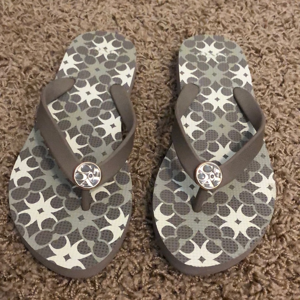 Grey and white Coach flip flops. Worn once.